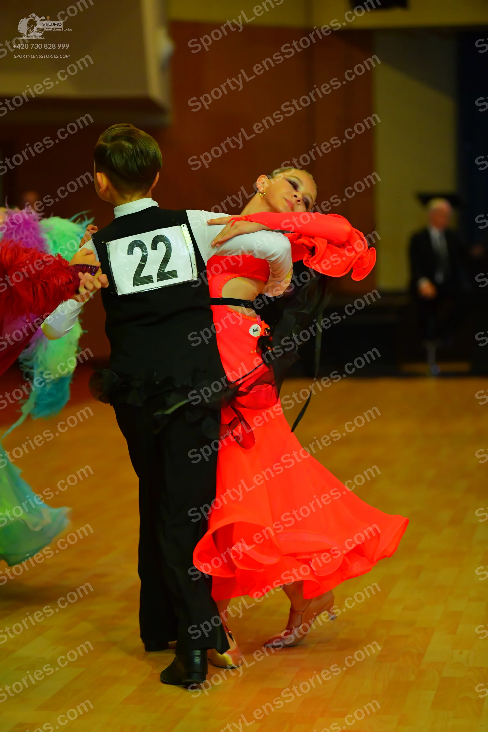 Dancesport competitor #22: Male dancer: black waistcoat, white long-sleeved shirt, and black trousers
