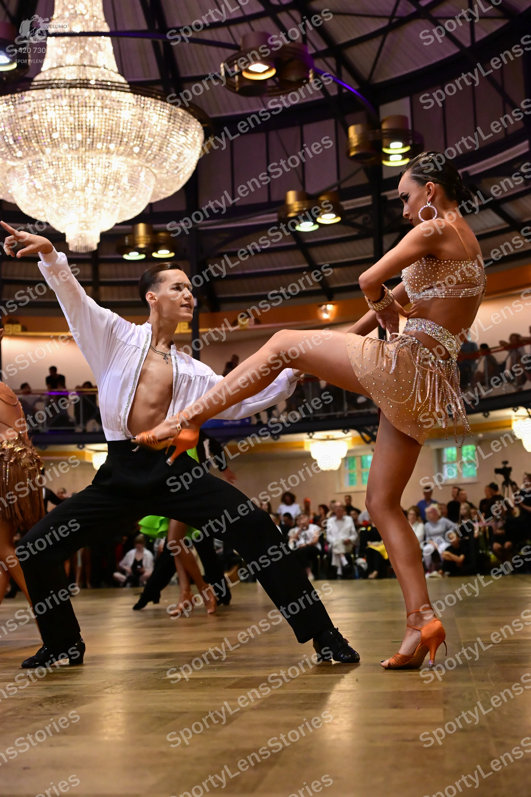 Dancesport competitor: Male dancer: white long-sleeved open jacket and black trousers