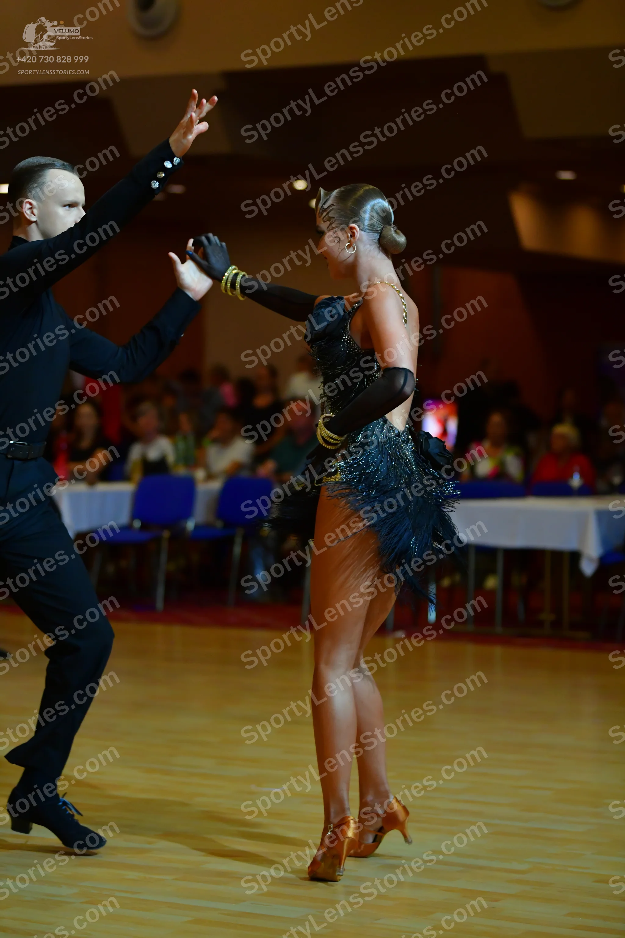 Dancesport competitor: Male dancer: black long-sleeved shirt and trousers