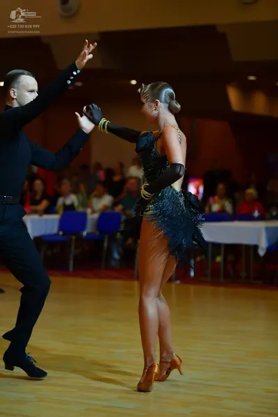 Dancesport competitor: Male dancer: black long-sleeved shirt and trousers