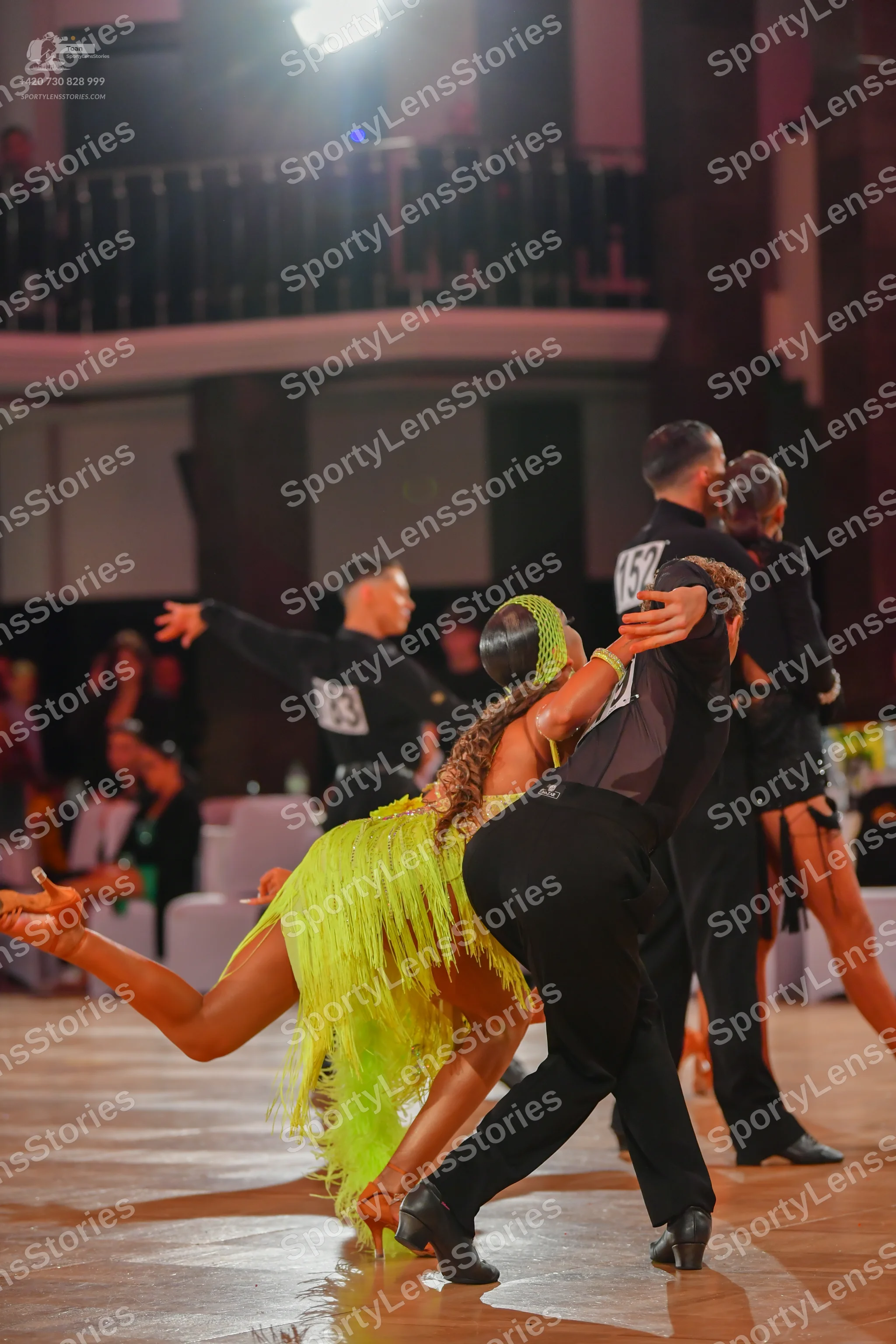 Dancesport competitor #83, #152: Male dancer (left): black long-sleeved shirt