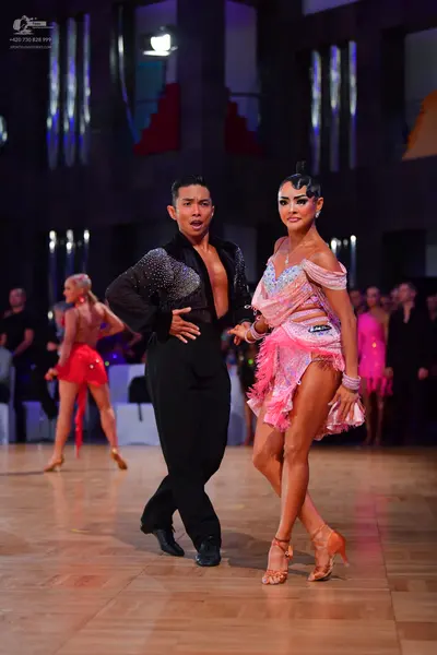 Dancesport competitor #145: Male dancer: black long-sleeved shirt with subtle sequins and black trousers