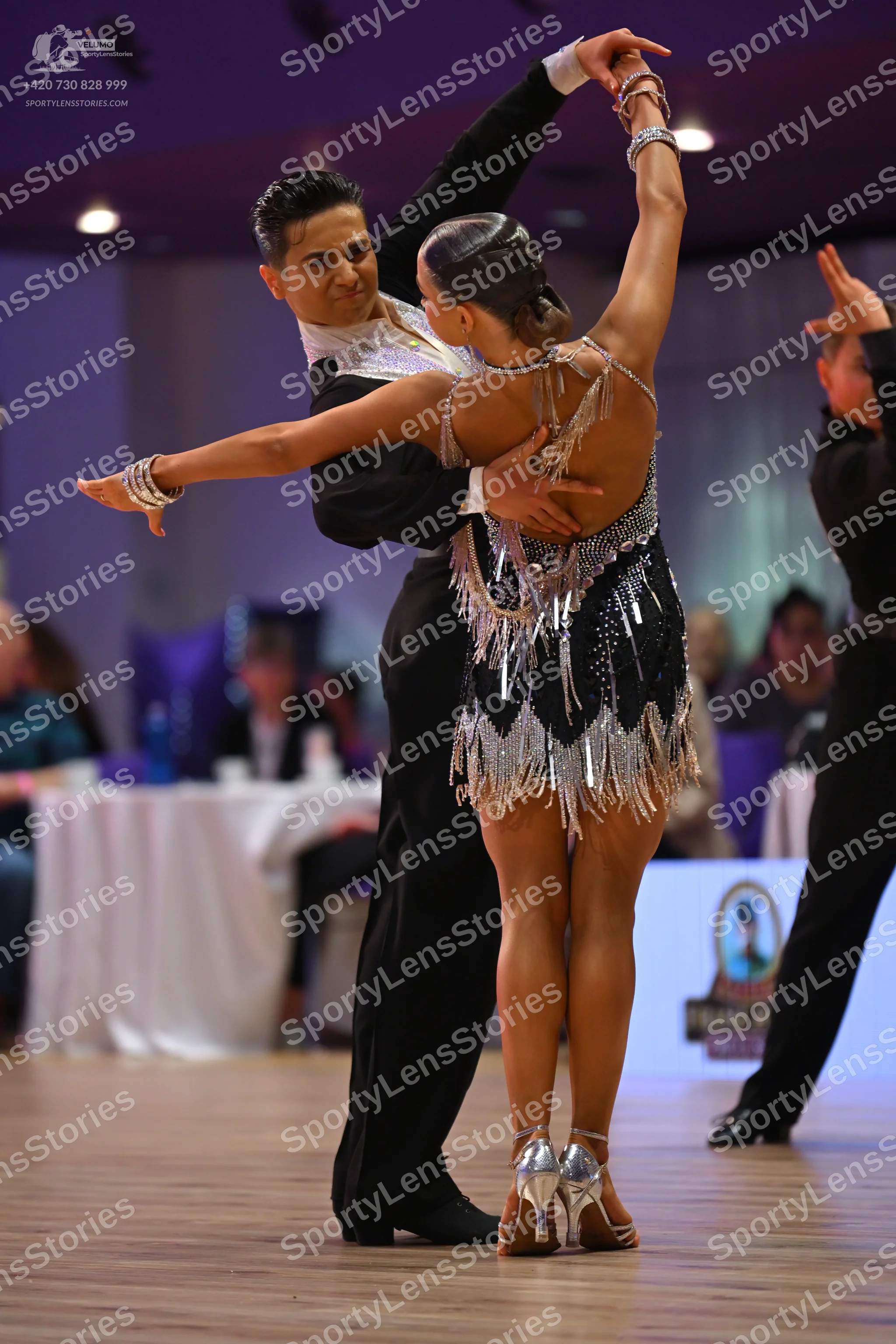 Dancesport competitor: Male dancer: black suit with a white detailed shirt