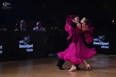 Dancesport competitor: Male dancer: black suit