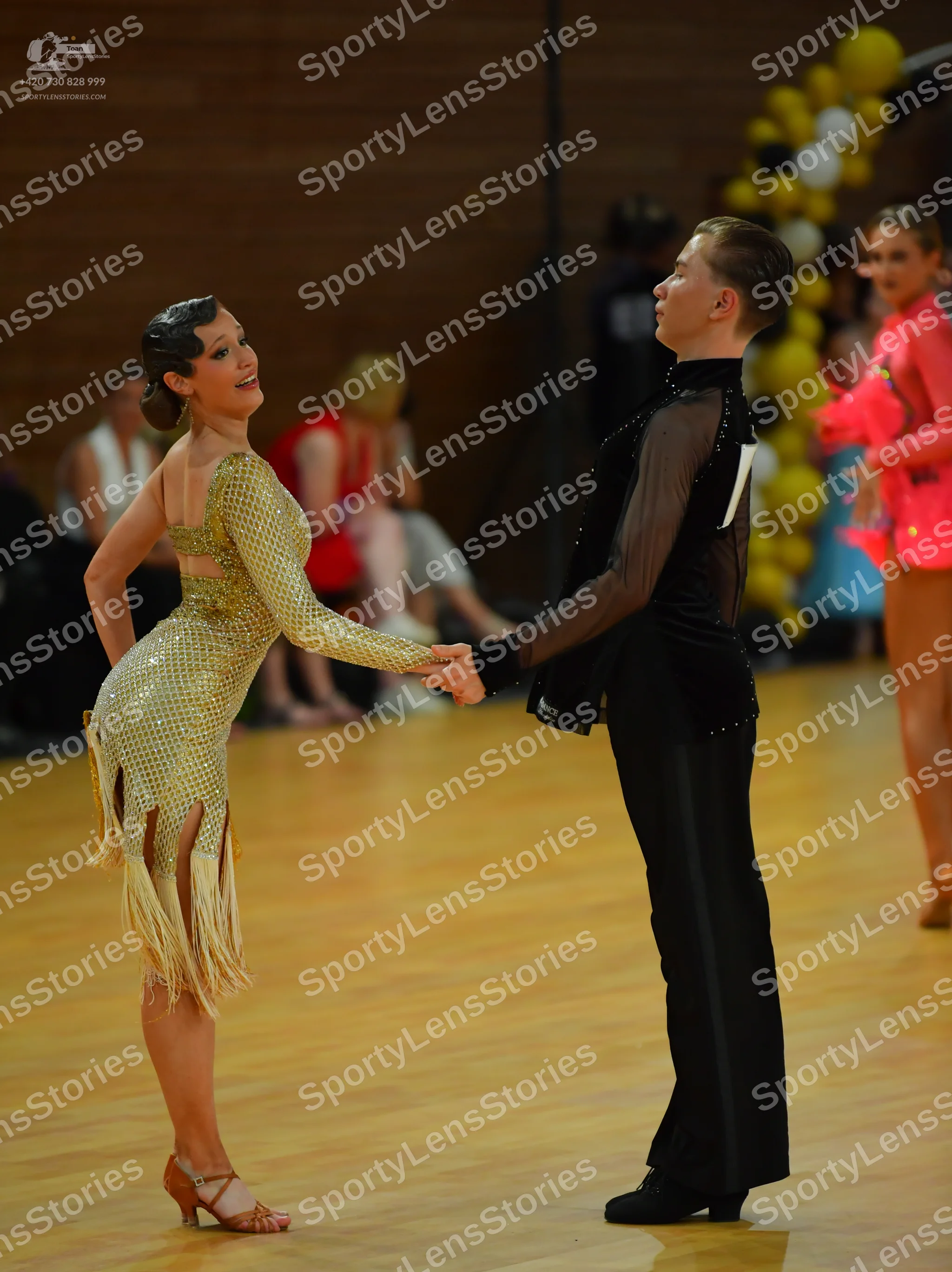 Dancesport competitor: ** Black tailsuit with sequin lapels