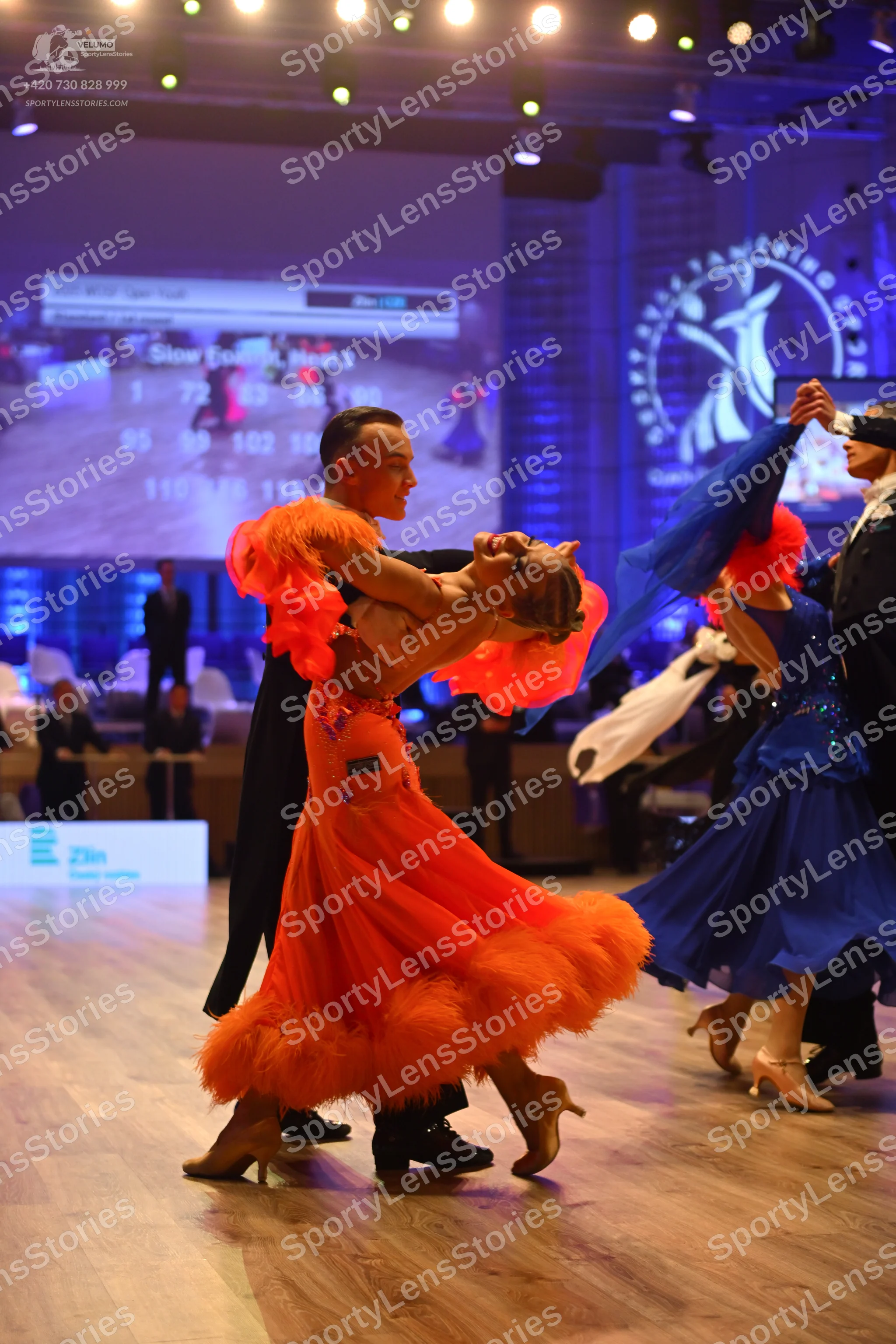 Dancesport competitor: Male dancer 1: black suit with black trousers and black dance shoes