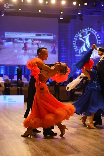 Dancesport competitor: Male dancer 1: black suit with black trousers and black dance shoes