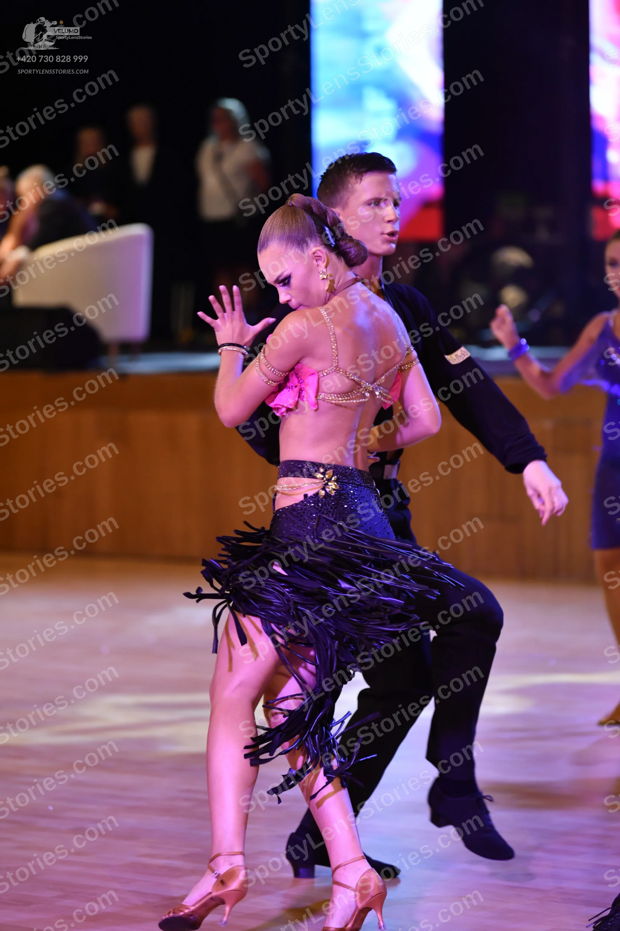 Dancesport competitor: ** Red Latin Dress
*   **Color:** Vibrant Red
*   **Fabric:** Satin (likely with