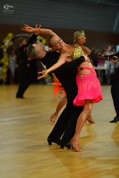 Dancesport competitor: Male dancer: black suit