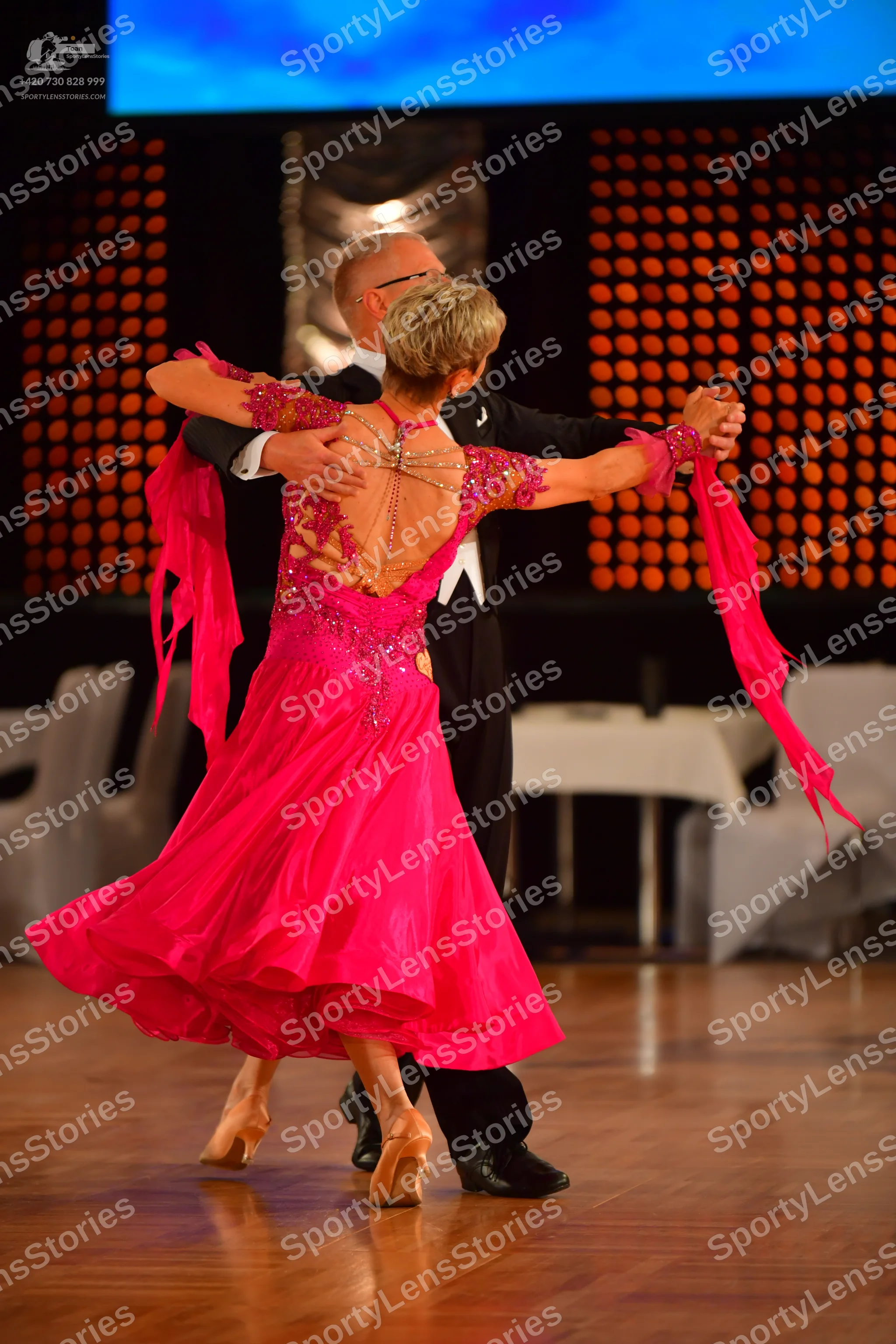 Dancesport competitor: Male dancer: black suit with a white shirt