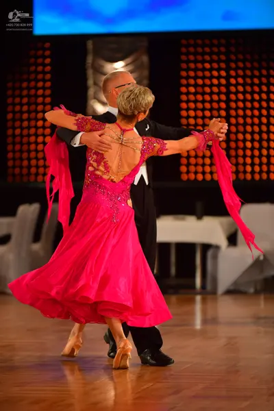 Dancesport competitor: Male dancer: black suit with a white shirt