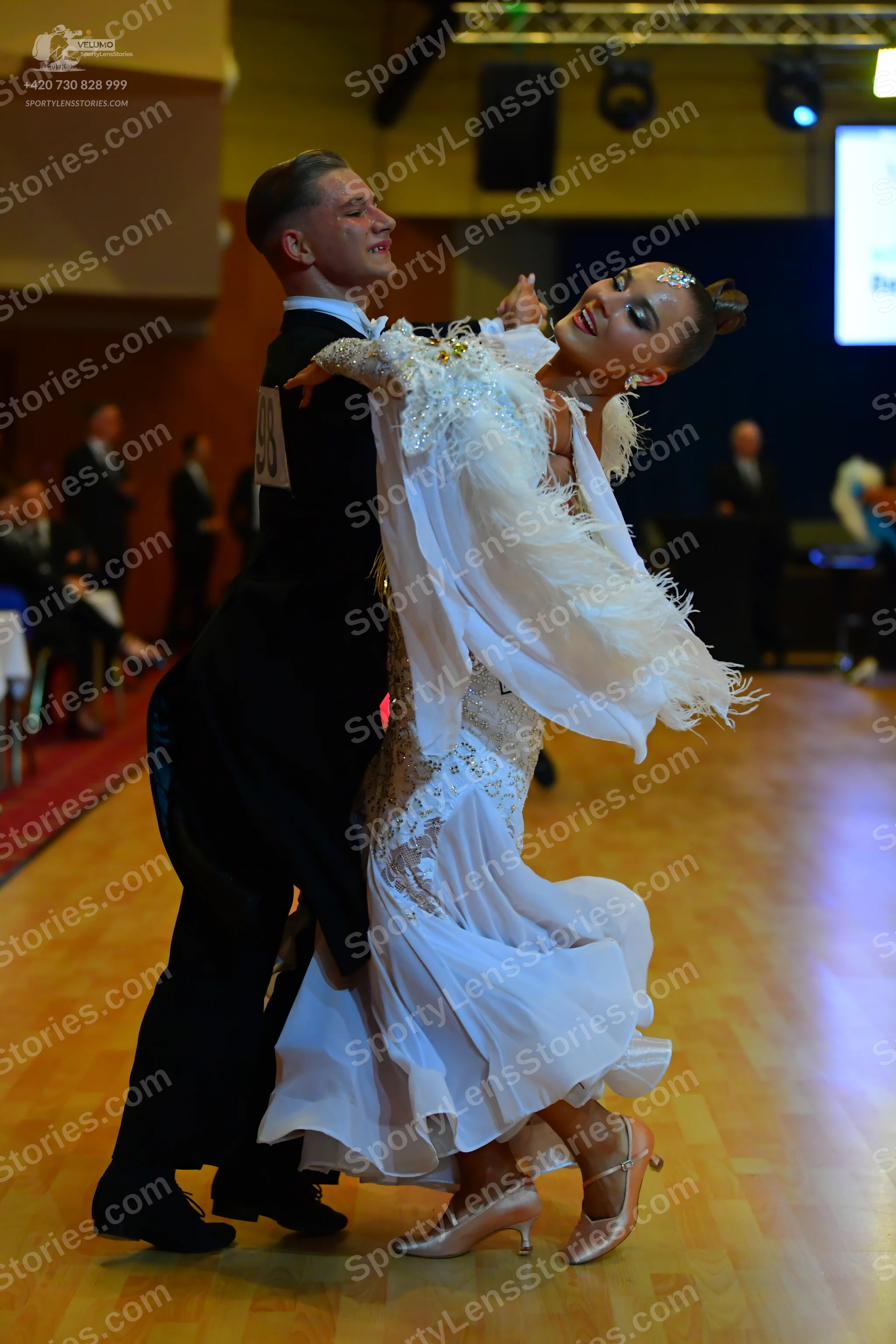Dancesport competitor: Male dancer: black suit, white shirt, black trousers, and black dance shoes
