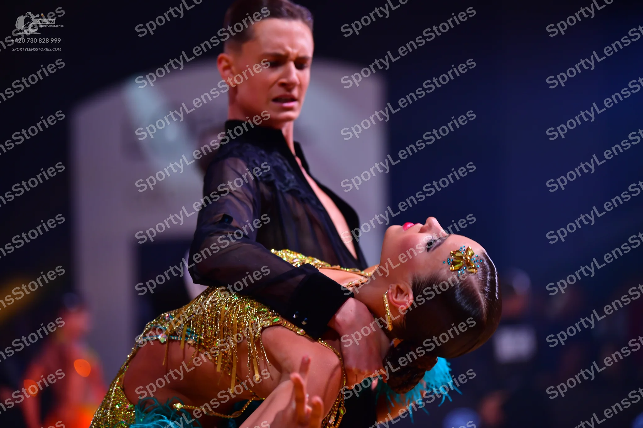 Dancesport competitor: Male dancer: black, partially sheer shirt with textured detail on the chest