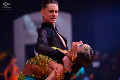 Dancesport competitor: Male dancer: black, partially sheer shirt with textured detail on the chest