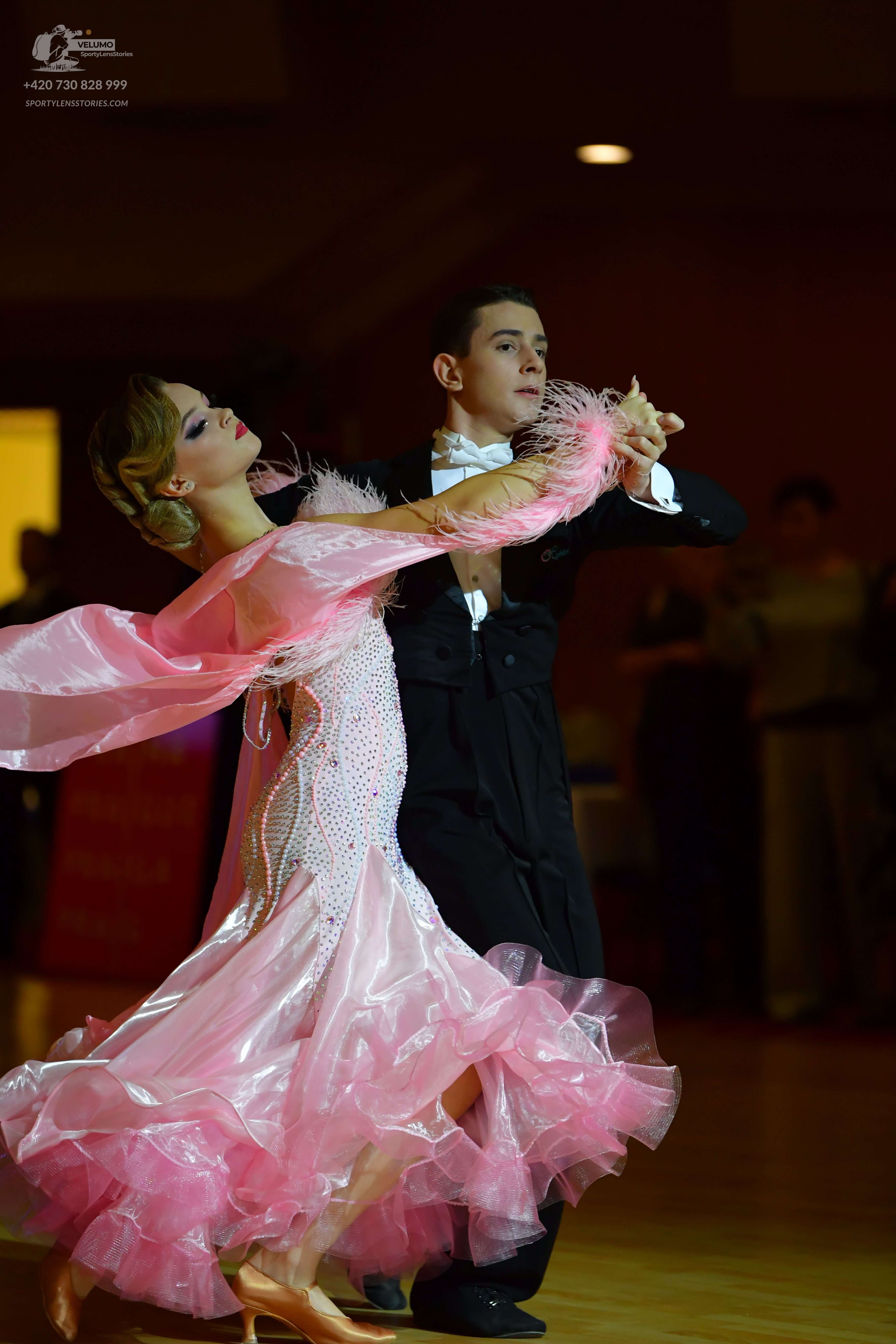Dancesport competitor: Male dancer: black formal suit with a white shirt and white bowtie