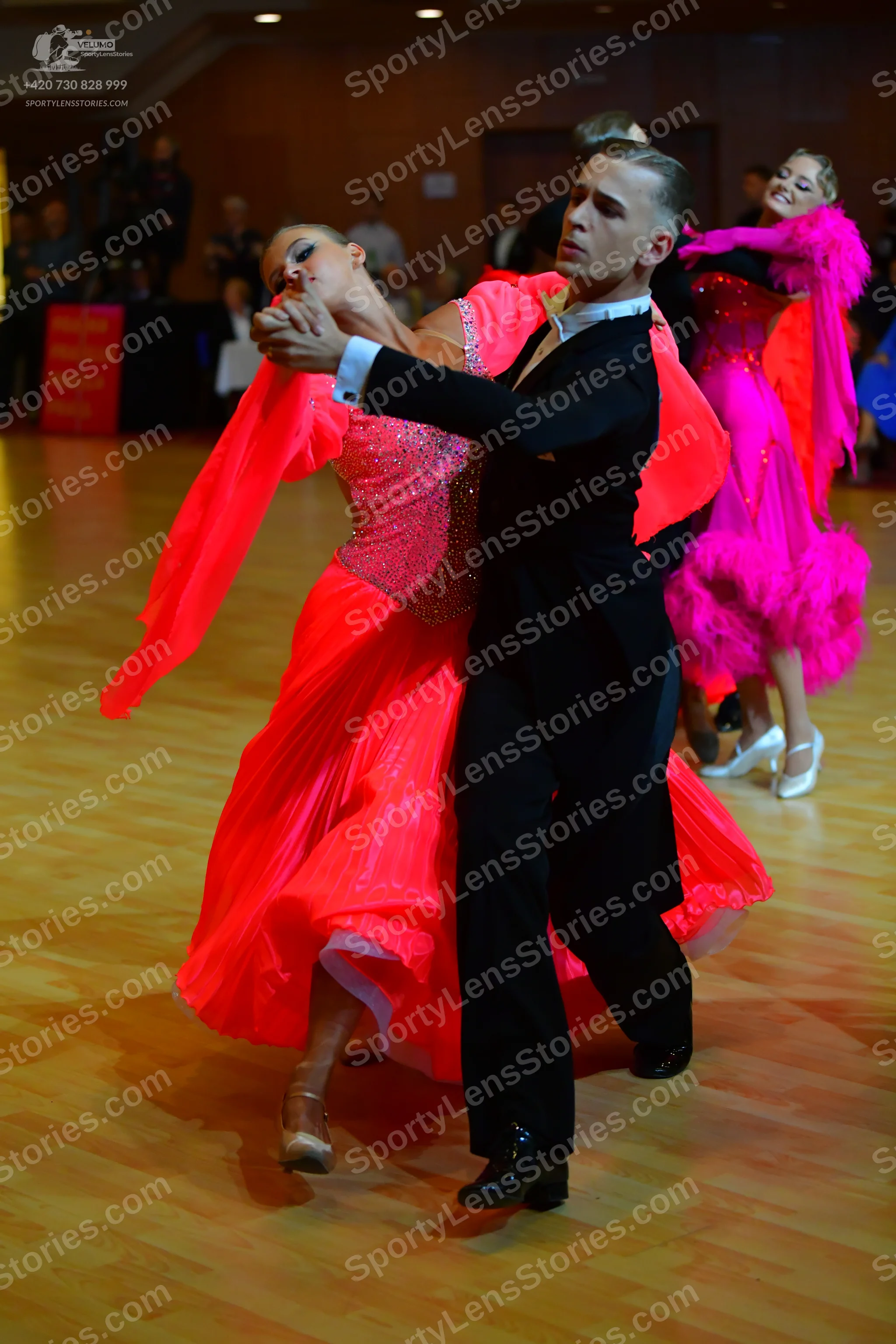 Dancesport competitor: Male dancer: black suit with a white shirt