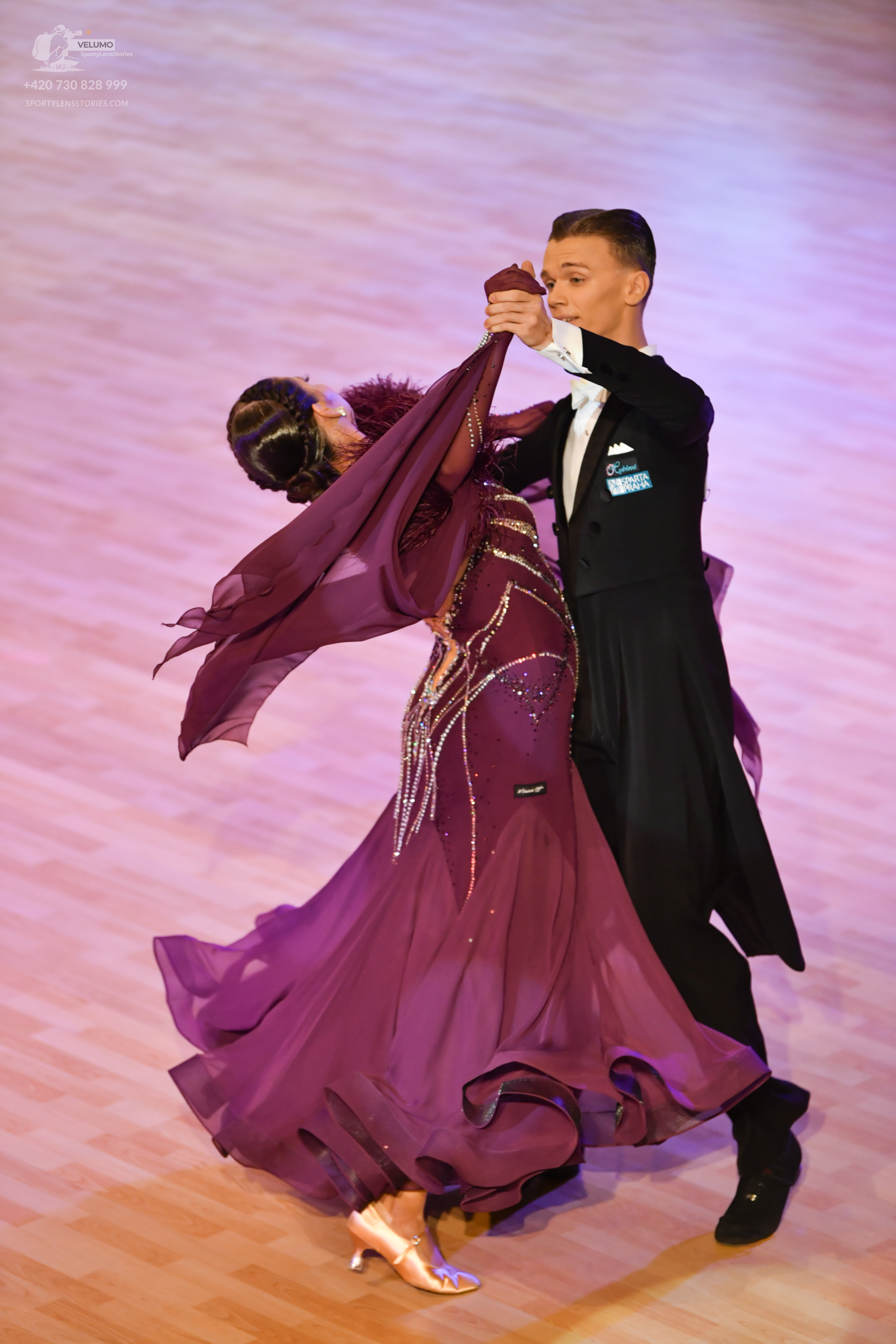 Dancesport competitor: Male dancer: black suit with a white shirt