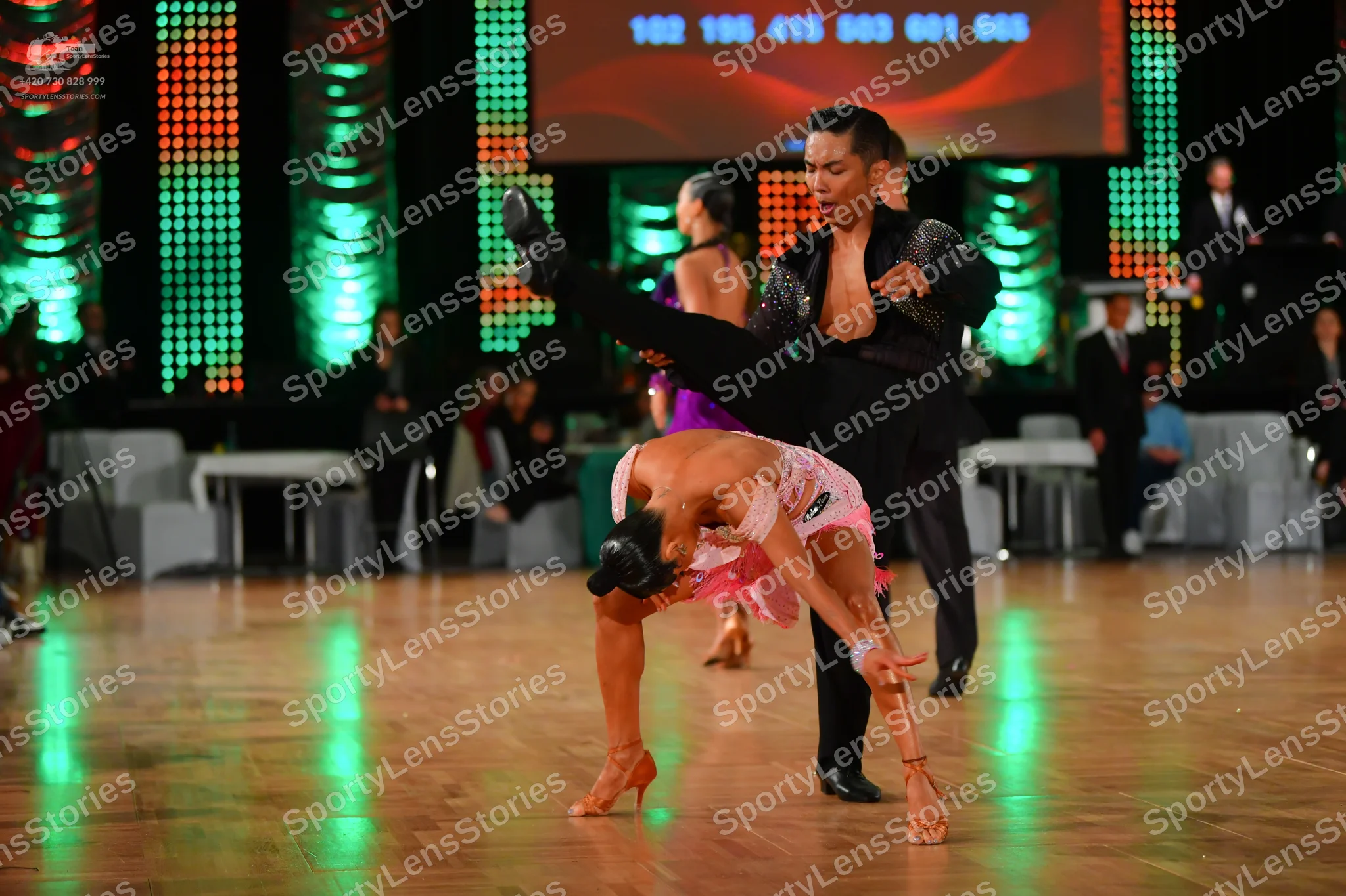 Dancesport competitor: Male dancer: black suit with textured/sequin details and black trousers
