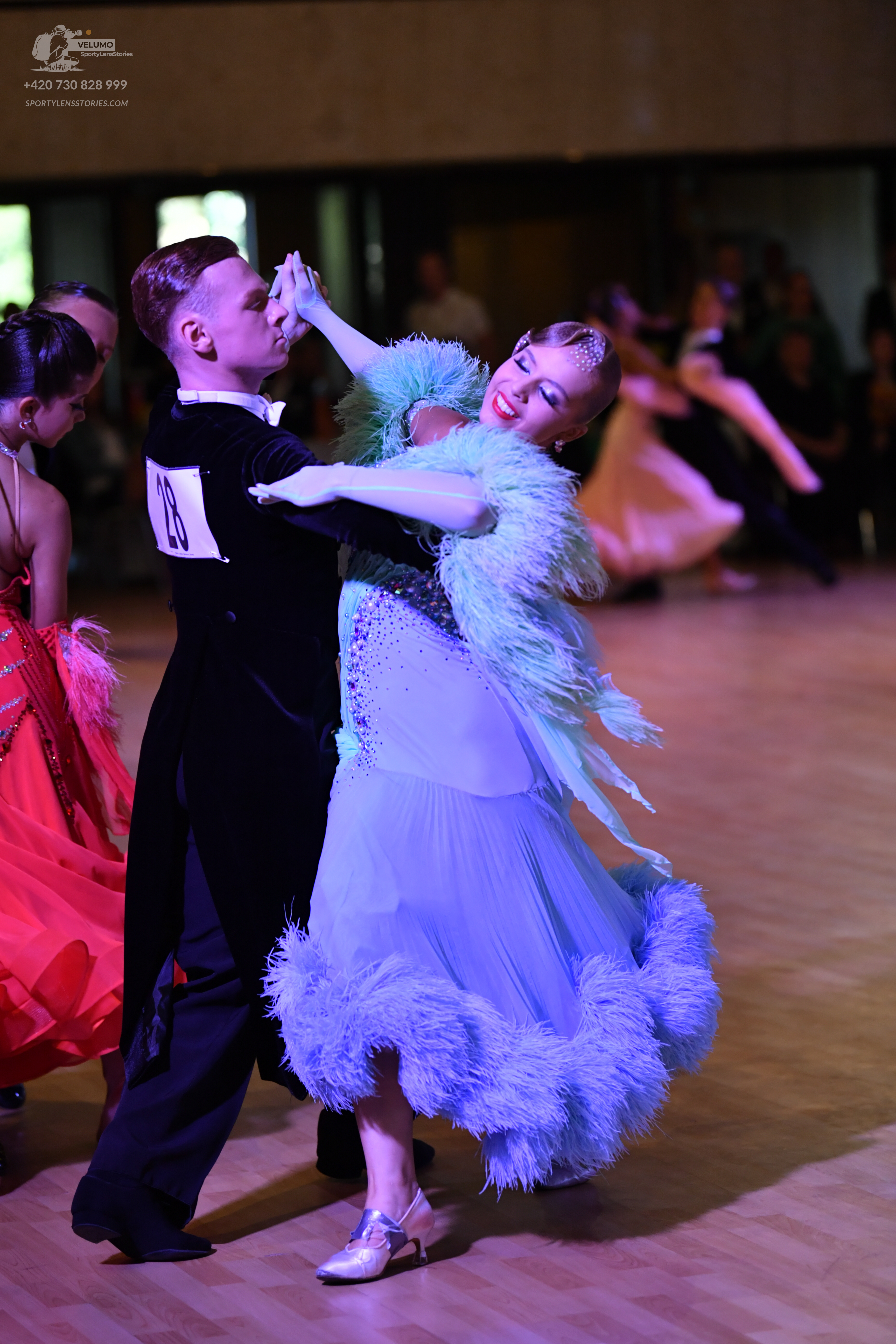 Dancesport competitor: ** Black tail suit with silver sequin lapels and cuffs