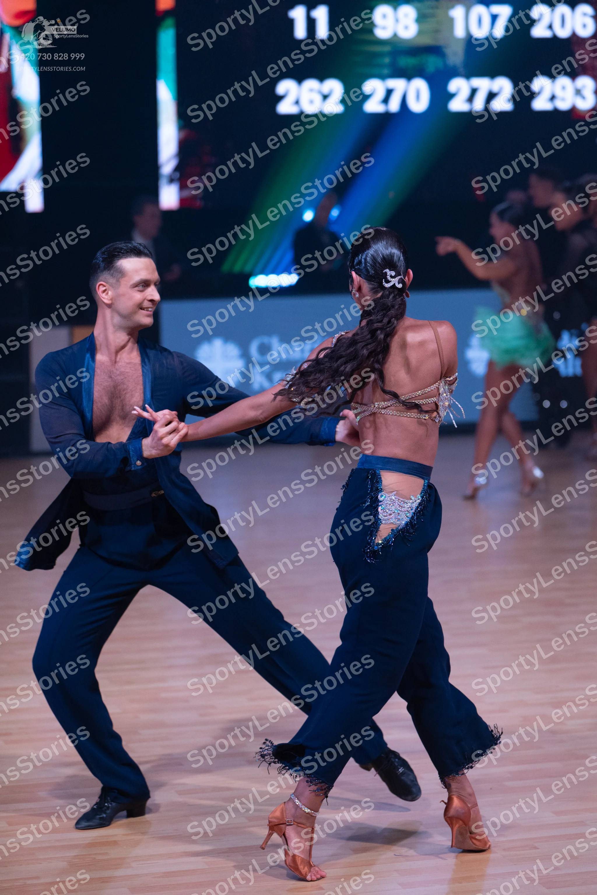 Dancesport competitor: Male dancer: navy blue open-front jacket and matching trousers