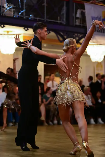 Dancesport competitor: Male dancer: black long-sleeved shirt and trousers