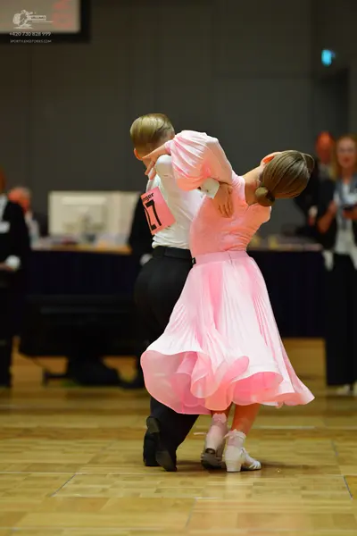 Dancesport competitor #27: Male dancer: white long-sleeved shirt and black trousers