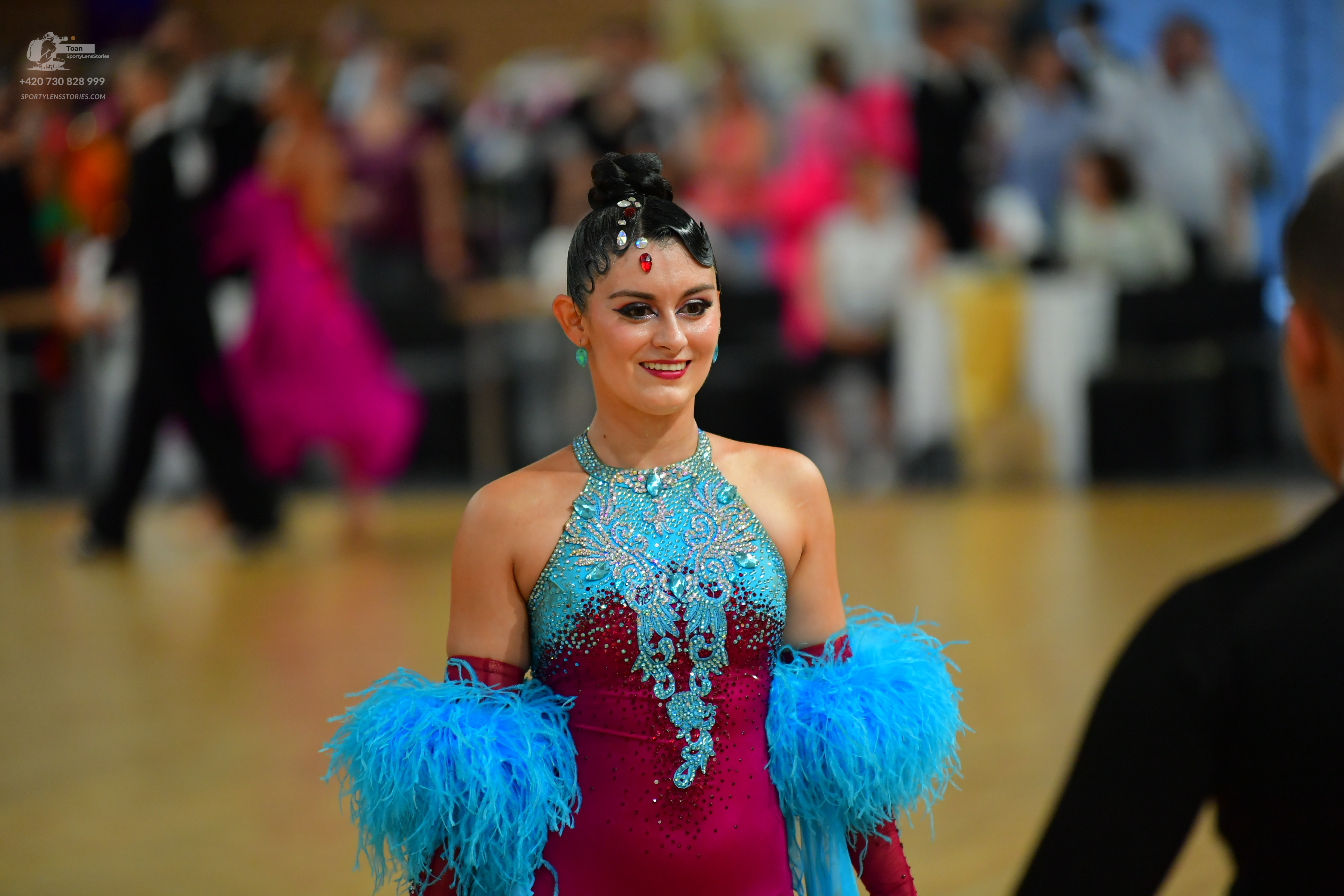 Dancesport competitor: ** Red Latin Dress
*   **Color:** Primarily Red
*   **Fabric:** Satin, likely wi