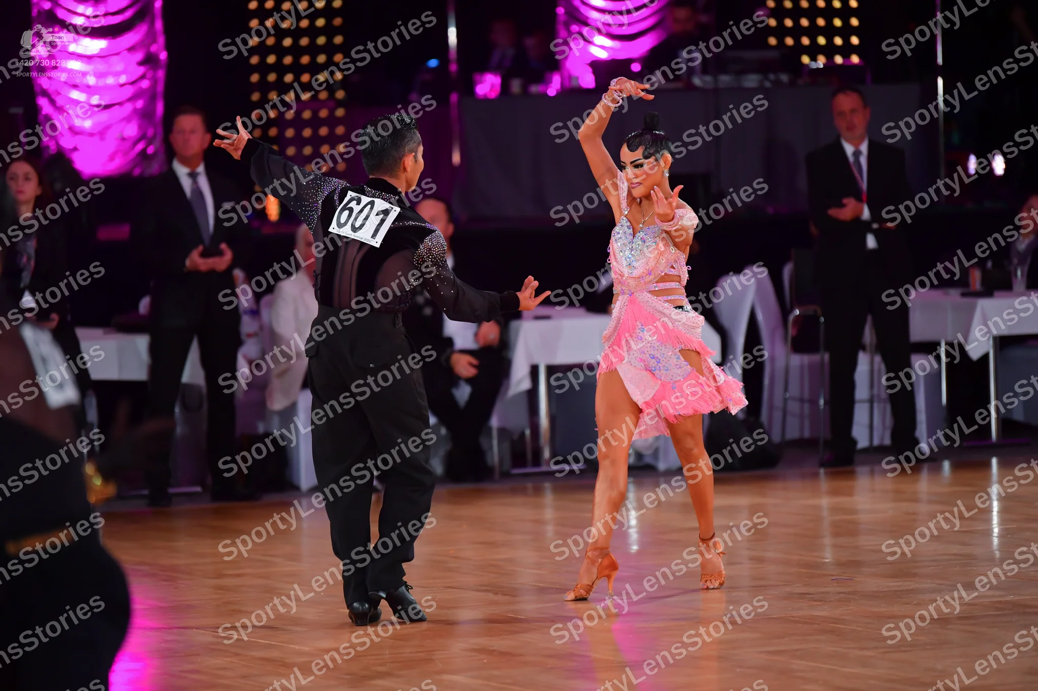 Dancesport competitor #601: Male dancer: black shirt with a textured, shimmering pattern and black trousers