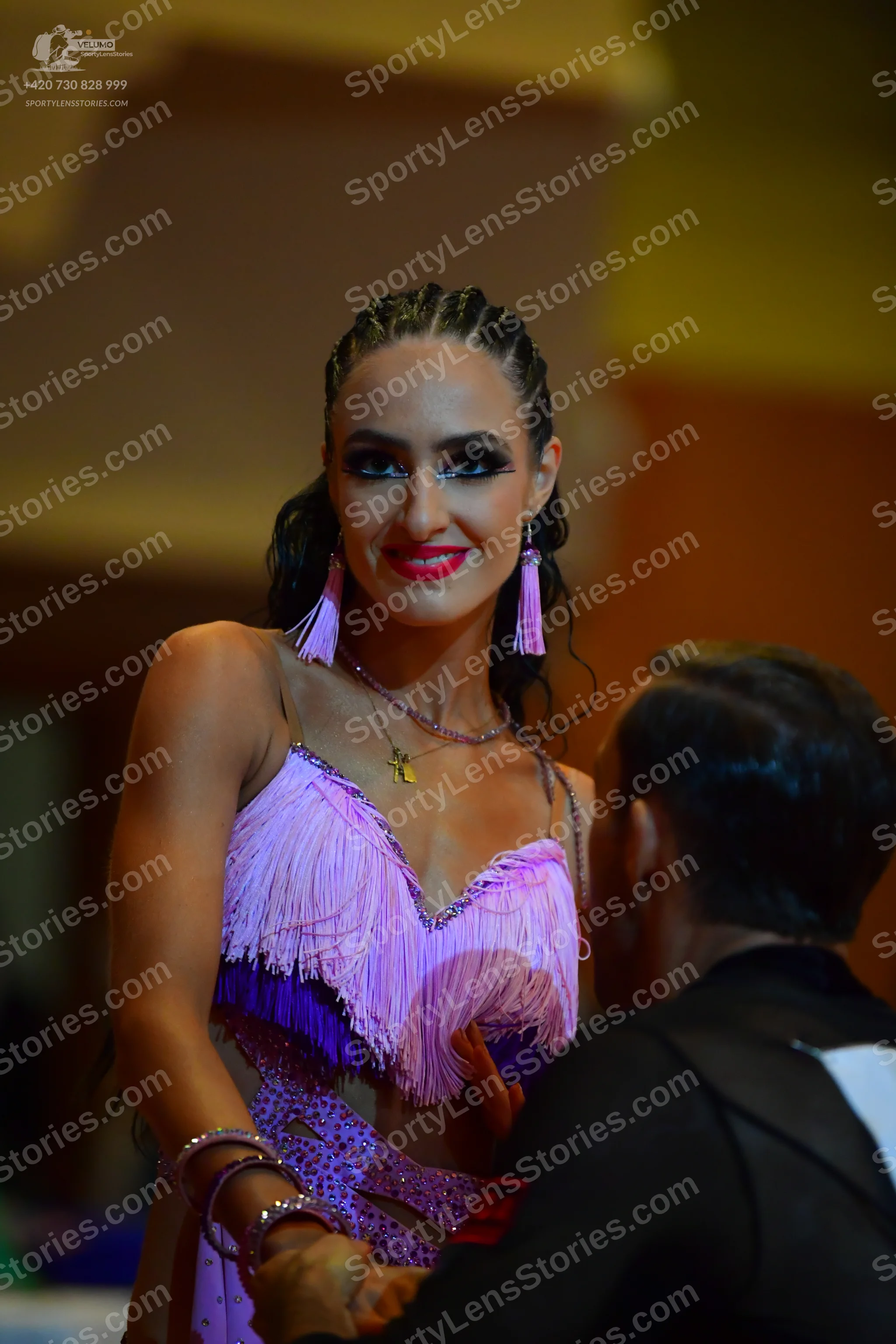 Dancesport competitor: Female dancer: light purple Latin dress with fringe, sequins, and mesh/lace deta