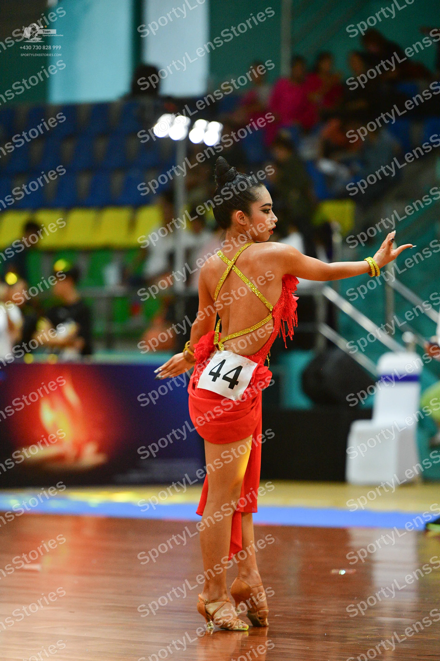 Dancesport competitor #44: ** Female
*   **Color:** Red
*   **Fabric:** Satin (appears to be a shiny satin)