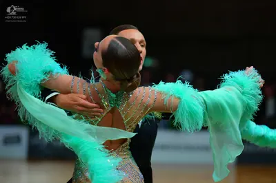 Dancesport competitor: Female dancer: mint green and silver latin dress with heavy sequin and crystal e