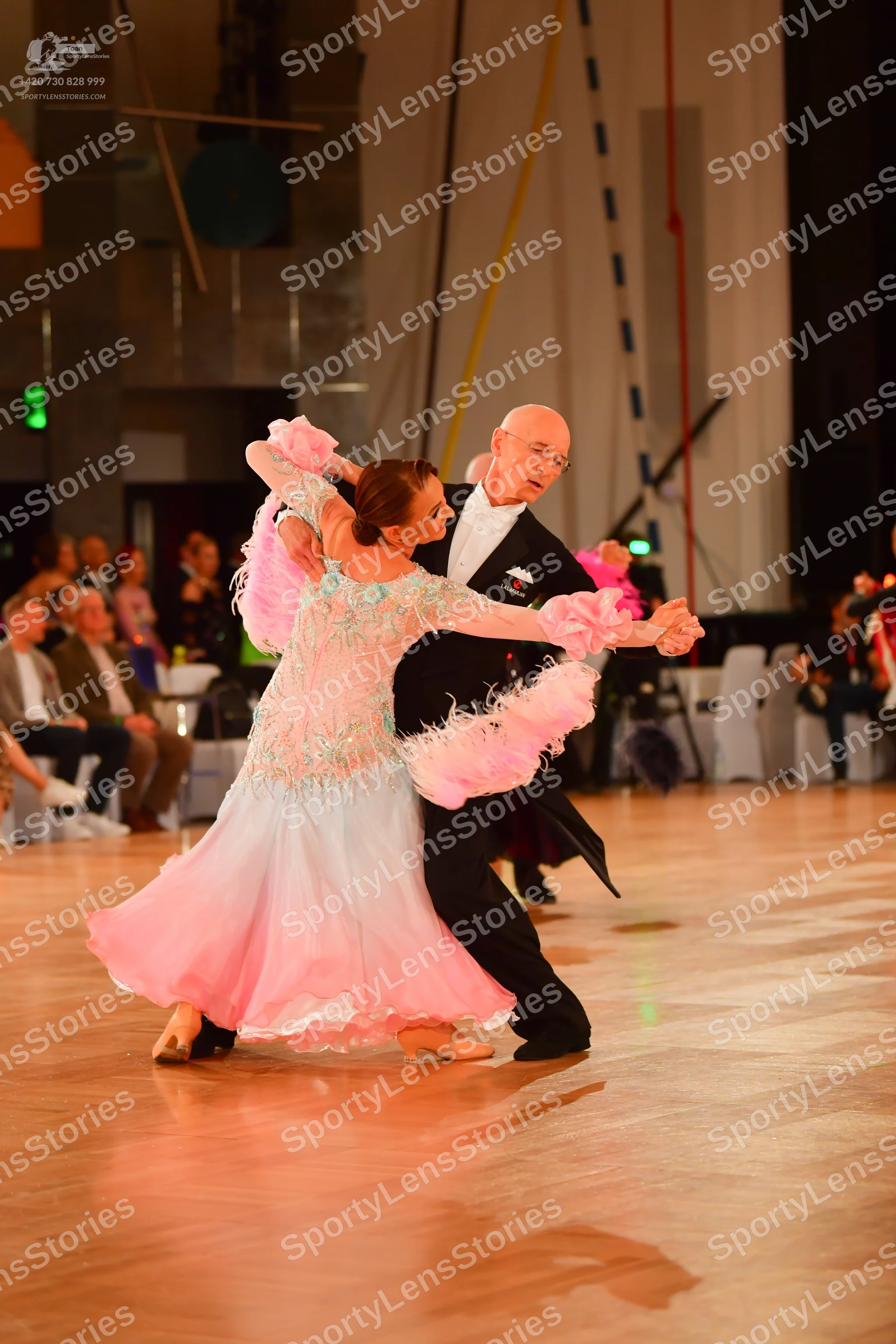 Dancesport competitor: Male dancer: black suit with a white shirt and black bow tie