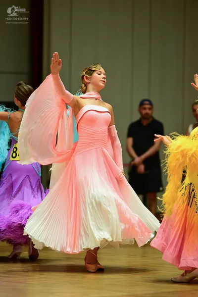 Dancesport competitor #8: ** Pale pink ballgown
*   **Color:** Pale pink
*   **Fabric:** Likely satin or a
