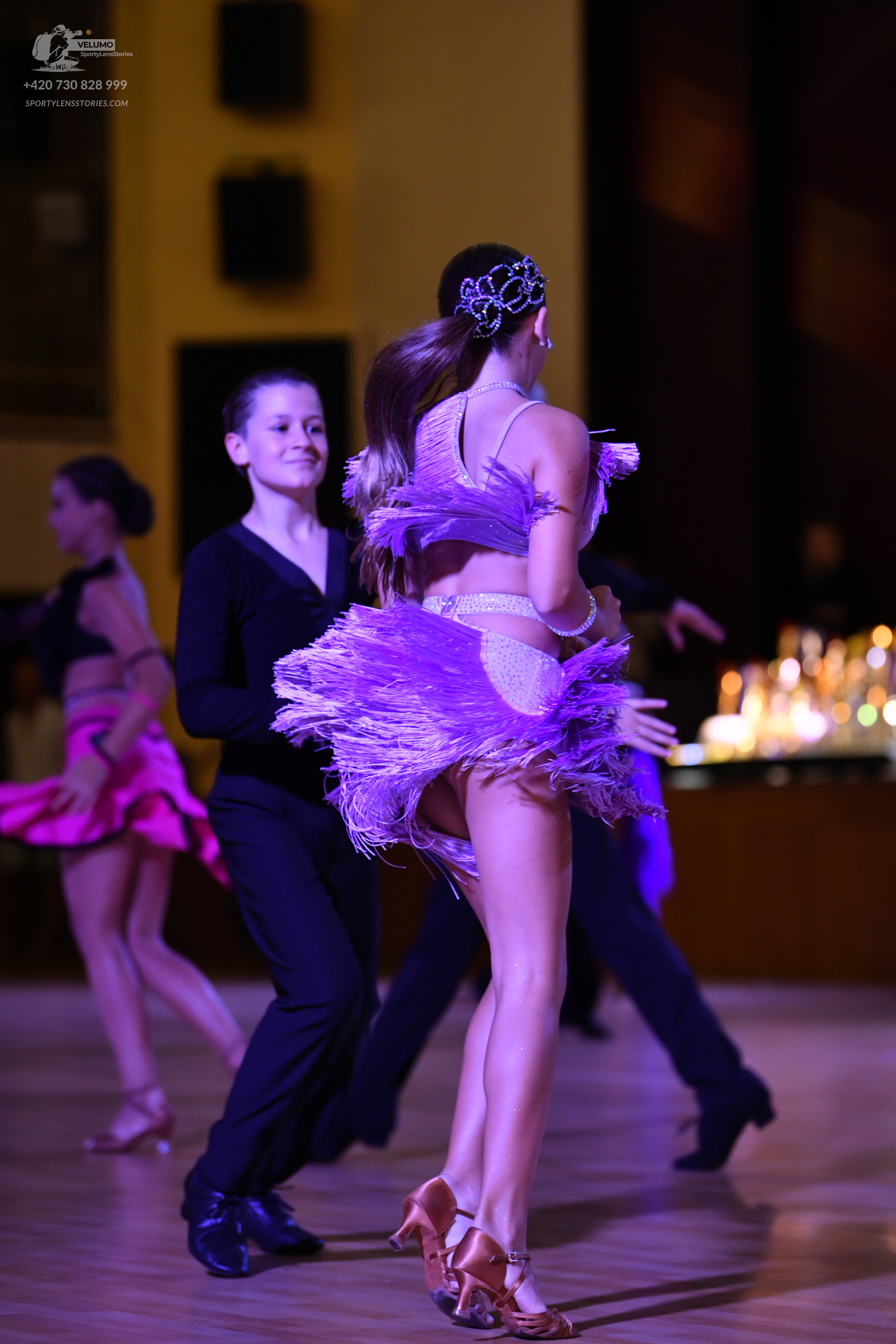 Dancesport competitor: ** Black suit with a sequined lapel