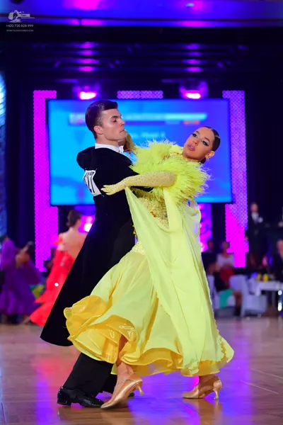 Dancesport competitor: Male dancer: black suit
