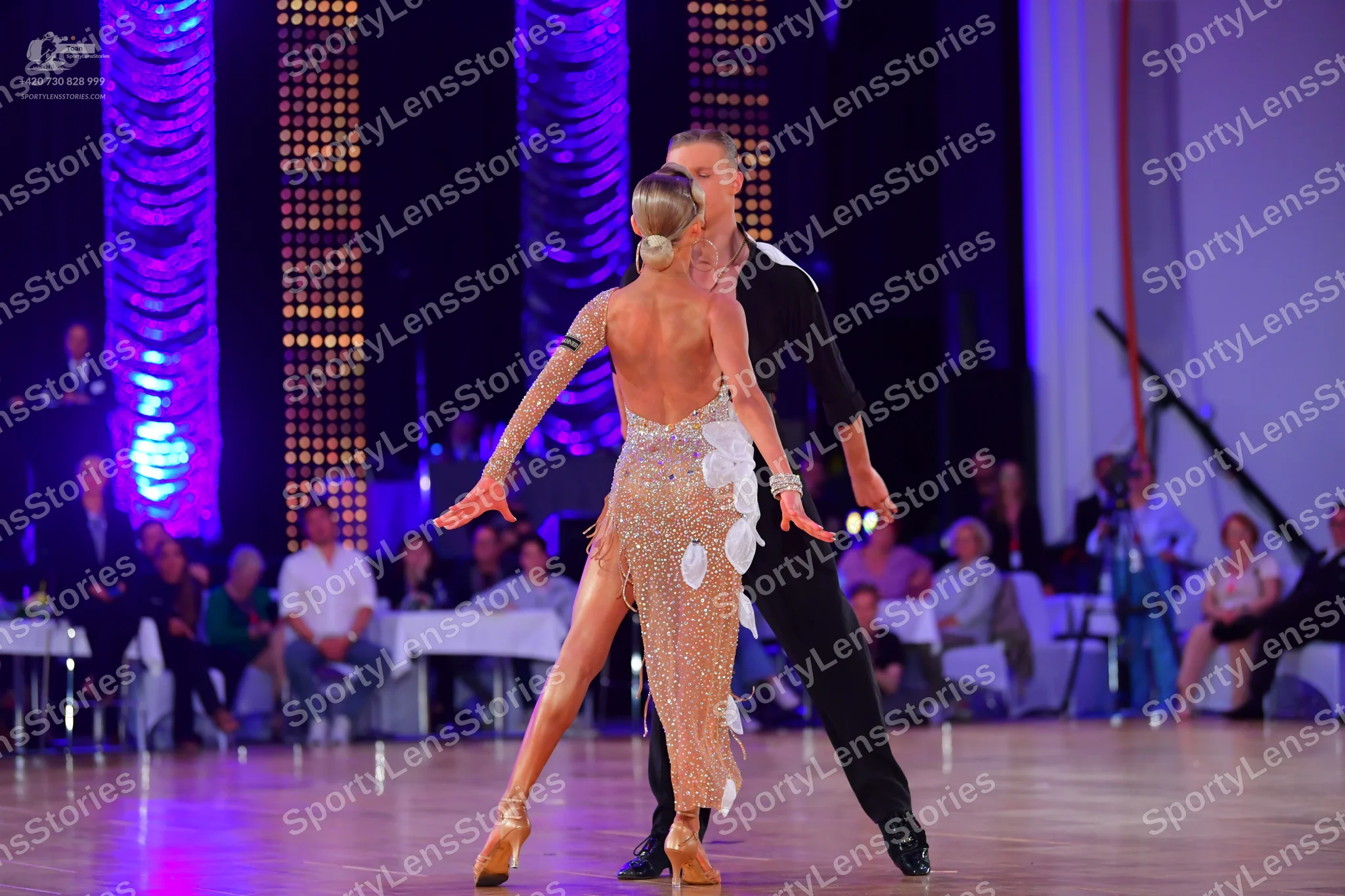 Dancesport competitor: Male dancer: black long-sleeved shirt and black trousers