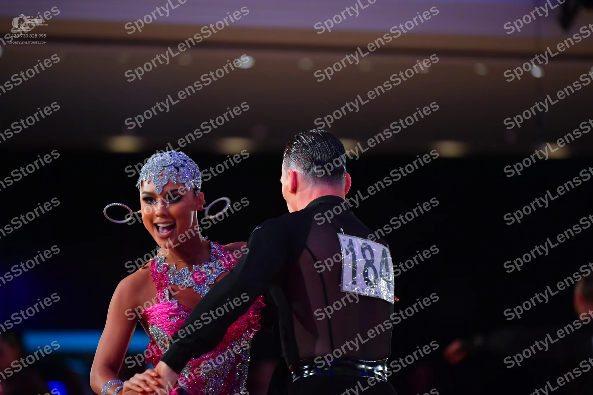 Dancesport competitor #184: Male dancer: black long-sleeved shirt with a sheer mesh back and black trousers