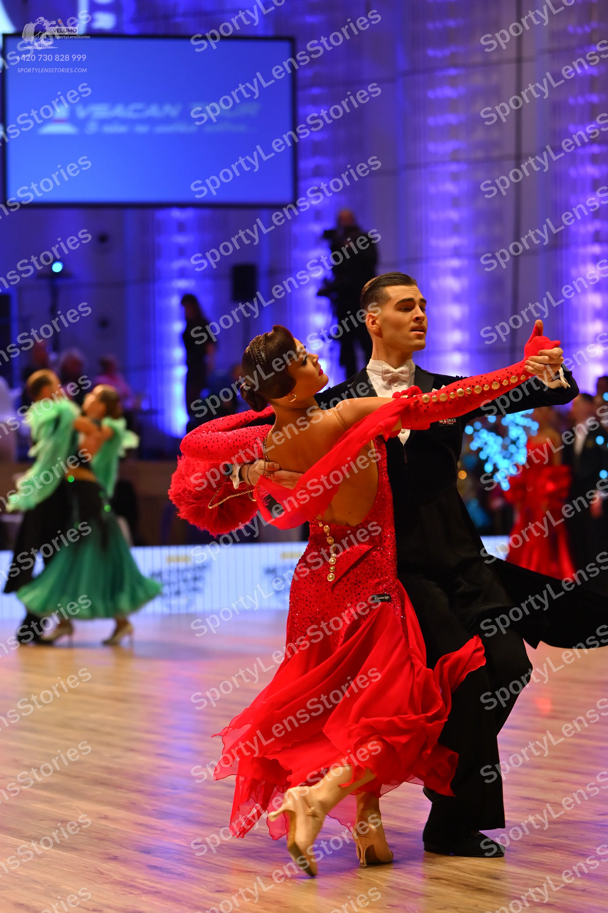 Dancesport competitor: Male dancer: black suit with white shirt and black bowtie