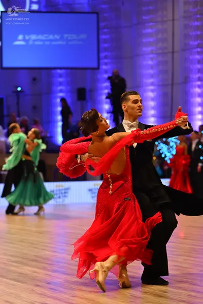 Dancesport competitor: Male dancer: black suit with white shirt and black bowtie