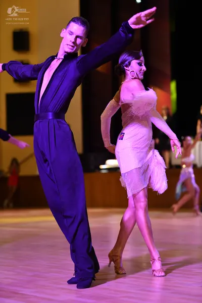 Dancesport competitor: ** Black tail suit
