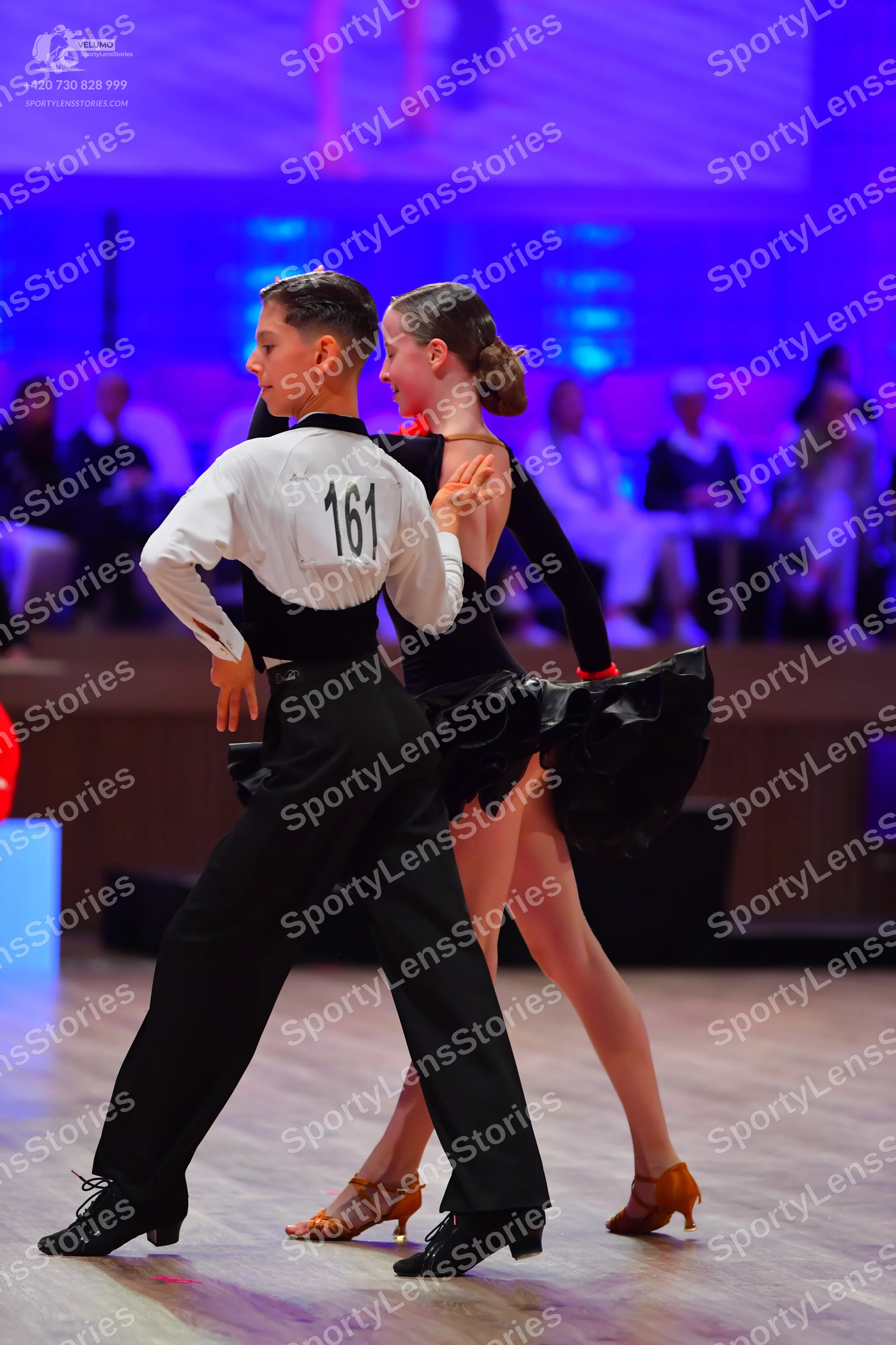Dancesport competitor: Male dancer: white long-sleeved shirt and black trousers
