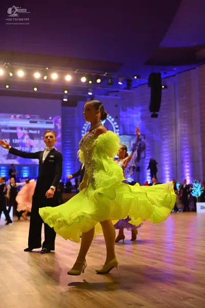 Dancesport competitor: Male dancer: black suit with a white shirt and black bow tie