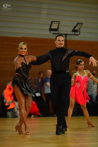Dancesport competitor: ** Black tailsuit