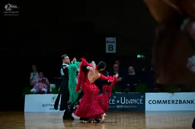 Dancesport competitor: Male dancer: black ballroom suit with a white shirt