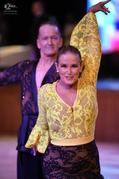 Dancesport competitor: ** Yellow lace gown