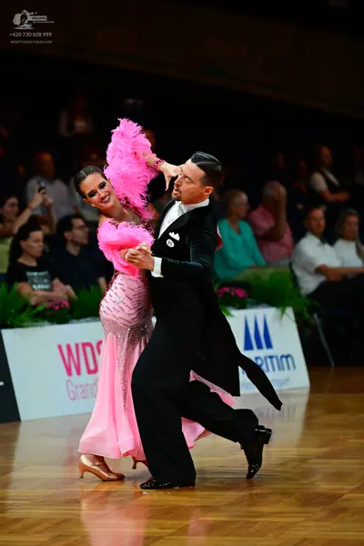 Dancesport competitor: Male dancer: black long-cut suit with a white shirt