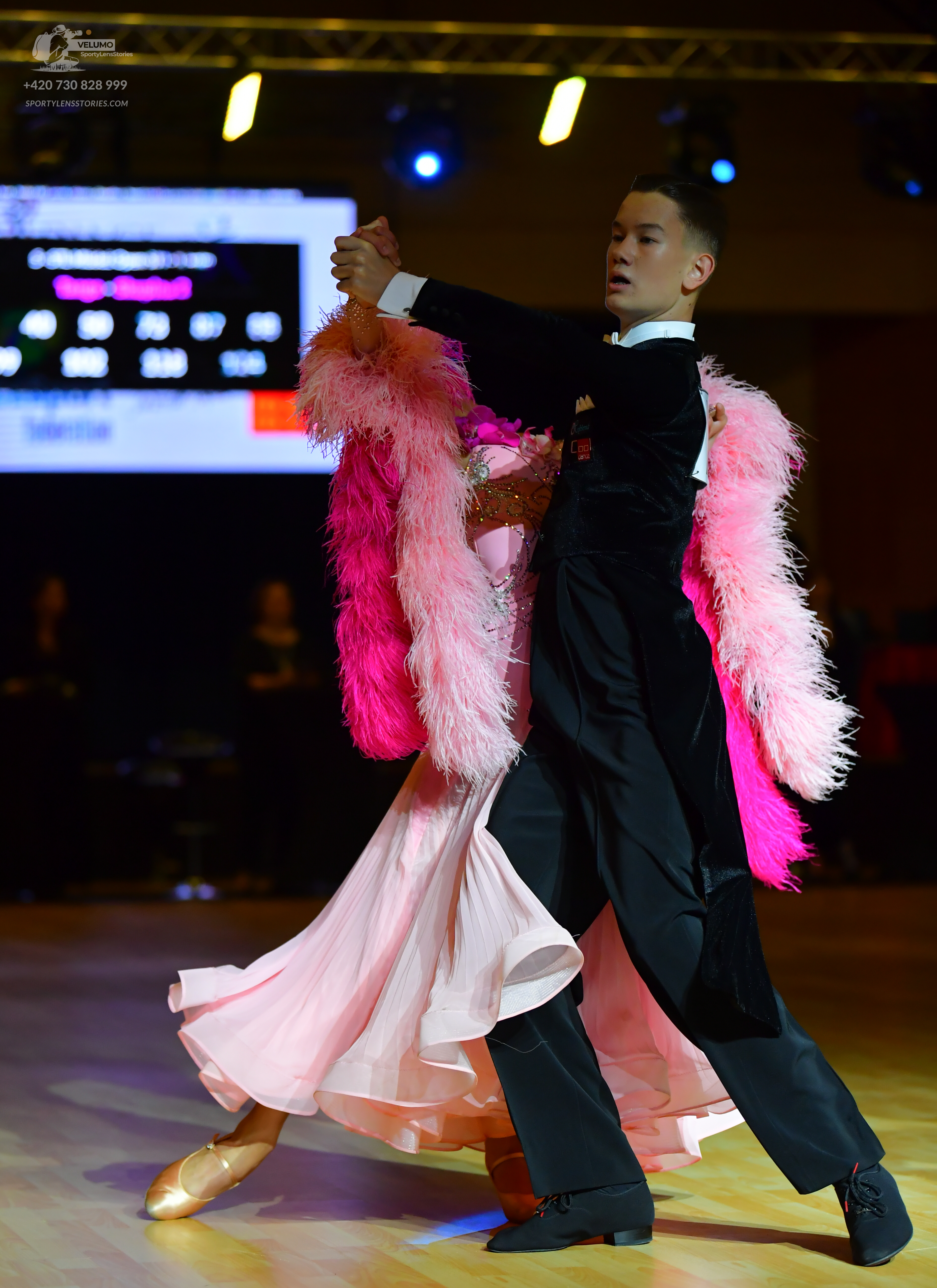 Dancesport competitor: Male dancer: black suit with a white shirt