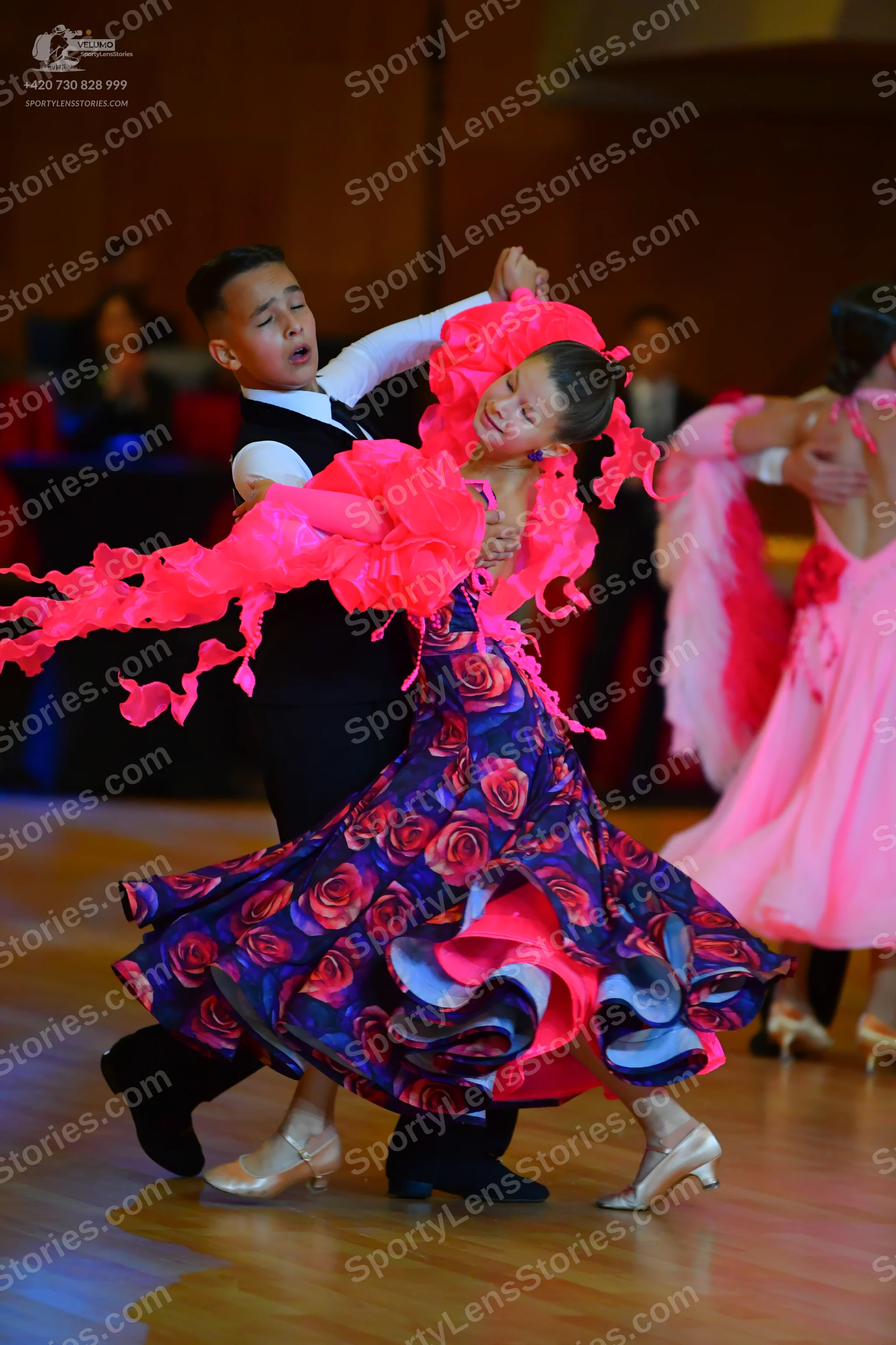 Dancesport competitor: Male dancer: black waistcoat over a white long-sleeved shirt