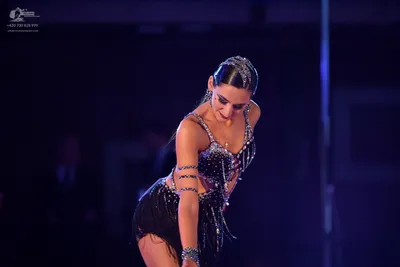 Dancesport competitor: Female dancer: black latin dance costume with sequin/rhinestone embellishments a