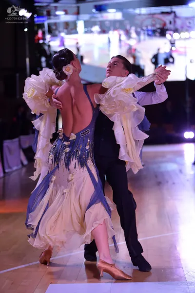 Dancesport competitor #21135: Male dancer: white long-sleeved shirt and black trousers